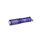 Olight Purple I3E EOS keychain flashlight with a gold geometric pattern for everyday carry.
