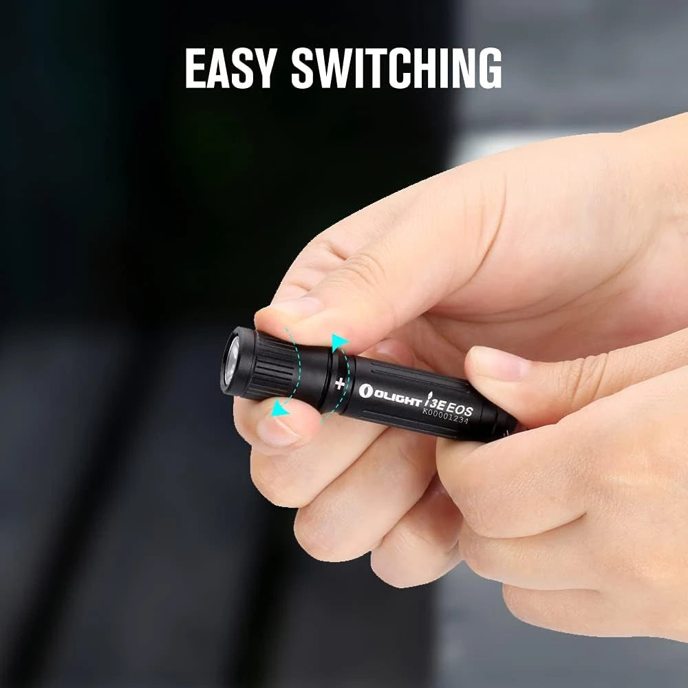 Olight Black I3E EOS Flashlight in Hand with Twist Switch for Everyday Carry