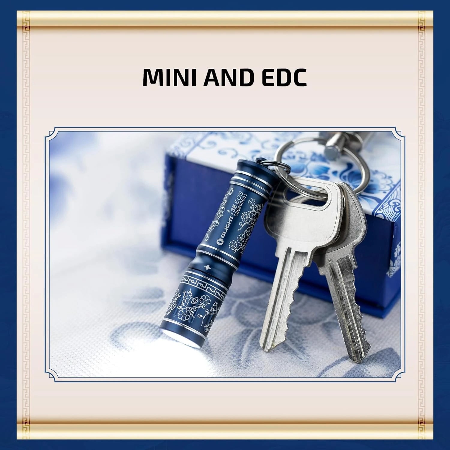 Olight I3E blue flashlight emitting light, attached to a keychain with keys, ready for EDC.