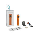 Olight Baton 4 Pro orange flashlight, charging dock, magnetic charging cable, and instruction manual.