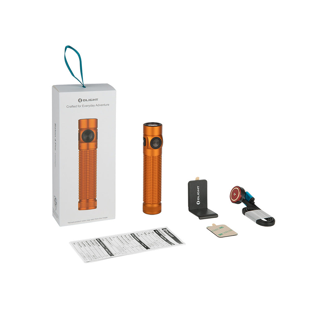 Olight Baton 4 Pro orange flashlight, charging dock, magnetic charging cable, and instruction manual.