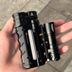 SK05 Pro 2 in Black held in the hand beside a tube torch, showing the flat profile