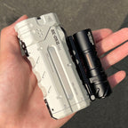 SK05 Pro 2 in Mao White held in the hand beside a tube torch, showing the flat profile